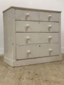 A Victorian white painted pine chest of drawers, fitted with two short and three long drawers, on