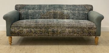 A large contemporary sofa, retailed by Anthropologie, the arms upholstered in a dusky blue loose