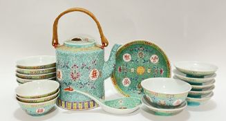 A polychrome enamelled Chinese porcelain tea/dinner service with lotuses, shou symbols, and