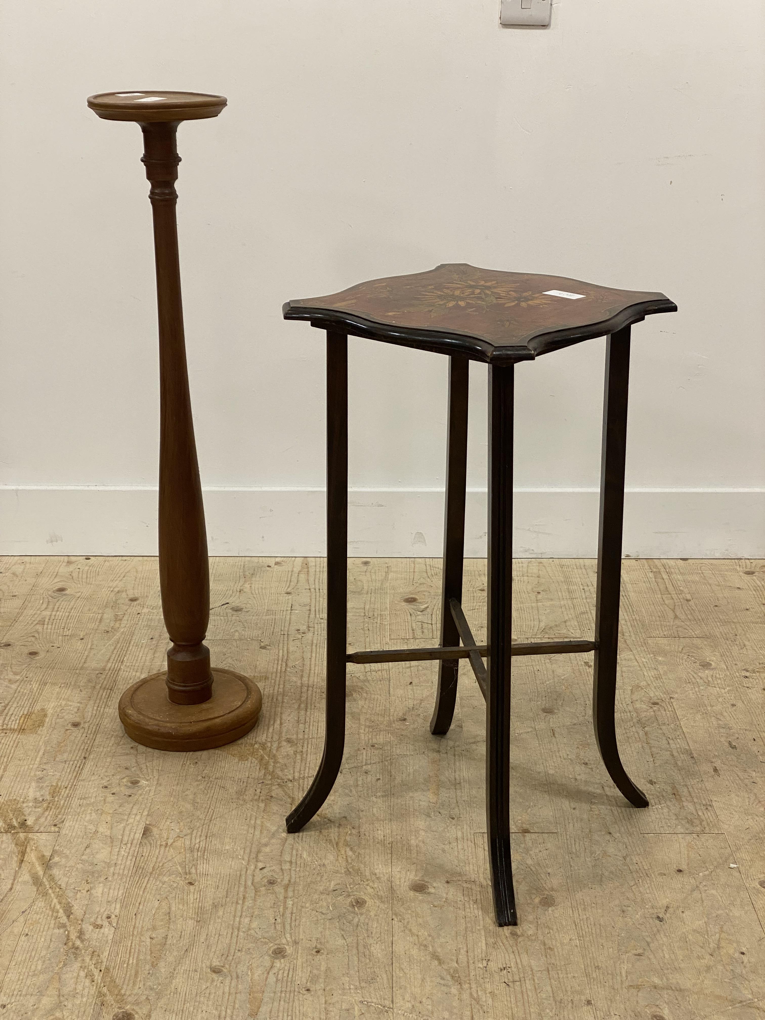 An early 20th century mahogany ocasional table, the serpentine top painted with floral design,