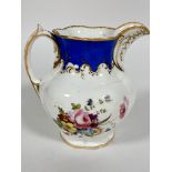 A late 19thc Paris porcelain water jug of fluted baluster form with C scroll handle to side,