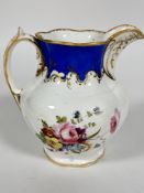 A late 19thc Paris porcelain water jug of fluted baluster form with C scroll handle to side,