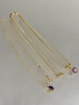 A 9ct gold snake link chain necklace with lobster claw fastening and yellow metal ruby and diamond