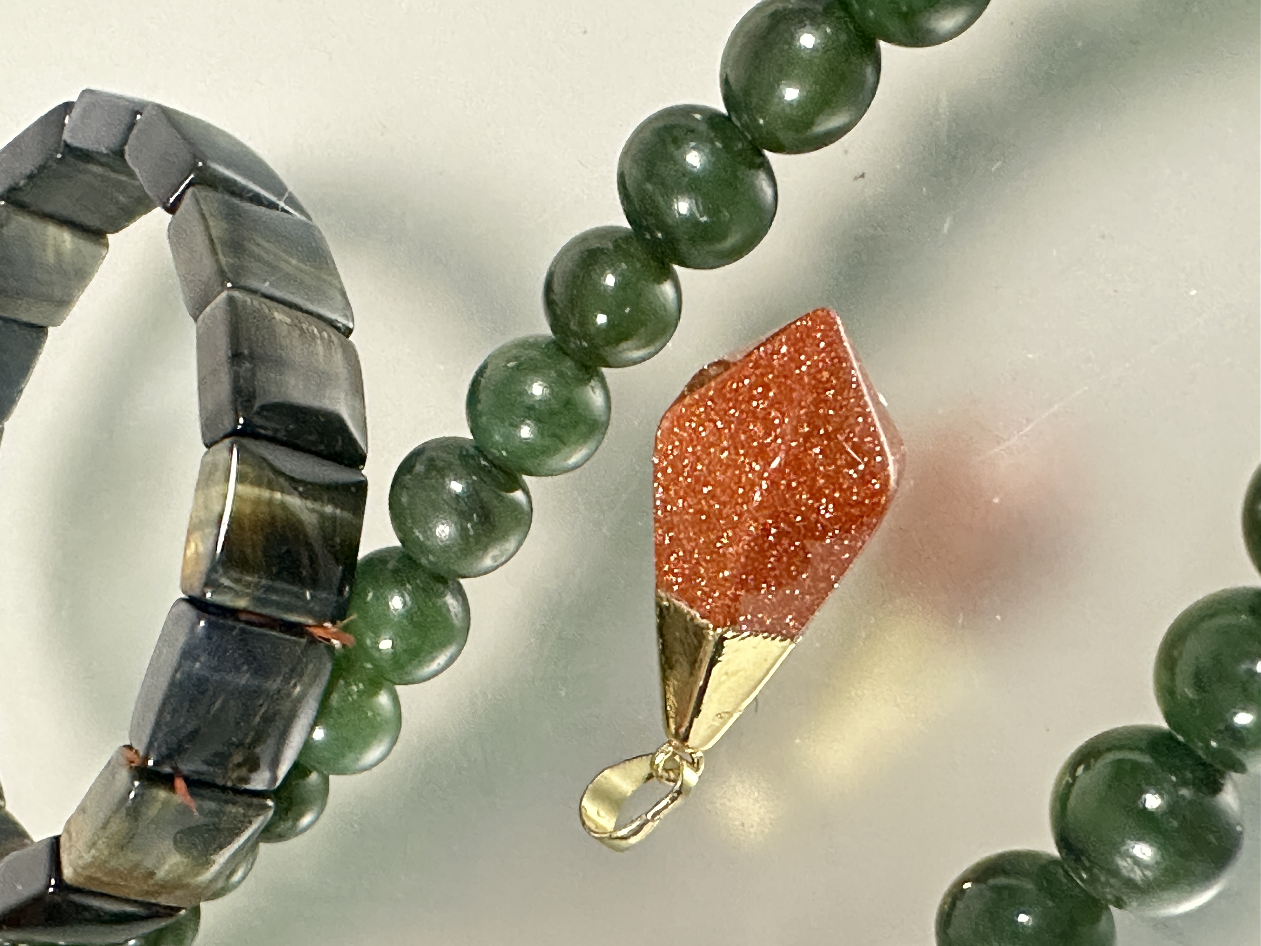 A dark green nephrite jade bead necklace with white metall barrel clasp fastening, (L X 27cm x D x - Image 2 of 3