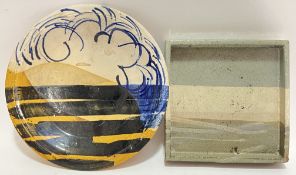 An unusual studio pottery slipware dish with abstract trailed designs in yellow/blue, together with