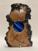 An unusual naturalistic contemporary burr elm sculpture, with a dark stained waney edge and inset to