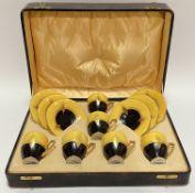 An Art Deco Carlton Ware travelling/presentation tea set comprising six cups and saucers in yellow a