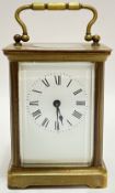A miniature carriage clock with white enamel dial and roman numeral indices, possibly Edwardian (h-