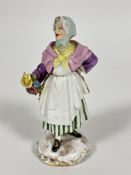 A 19thc Derby porcelain figure of a lady with green and white stripped skirt raised on socolo