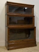 Globe Wernike, an early 20th century oak three height sectional bookcase fitted with glazed up and
