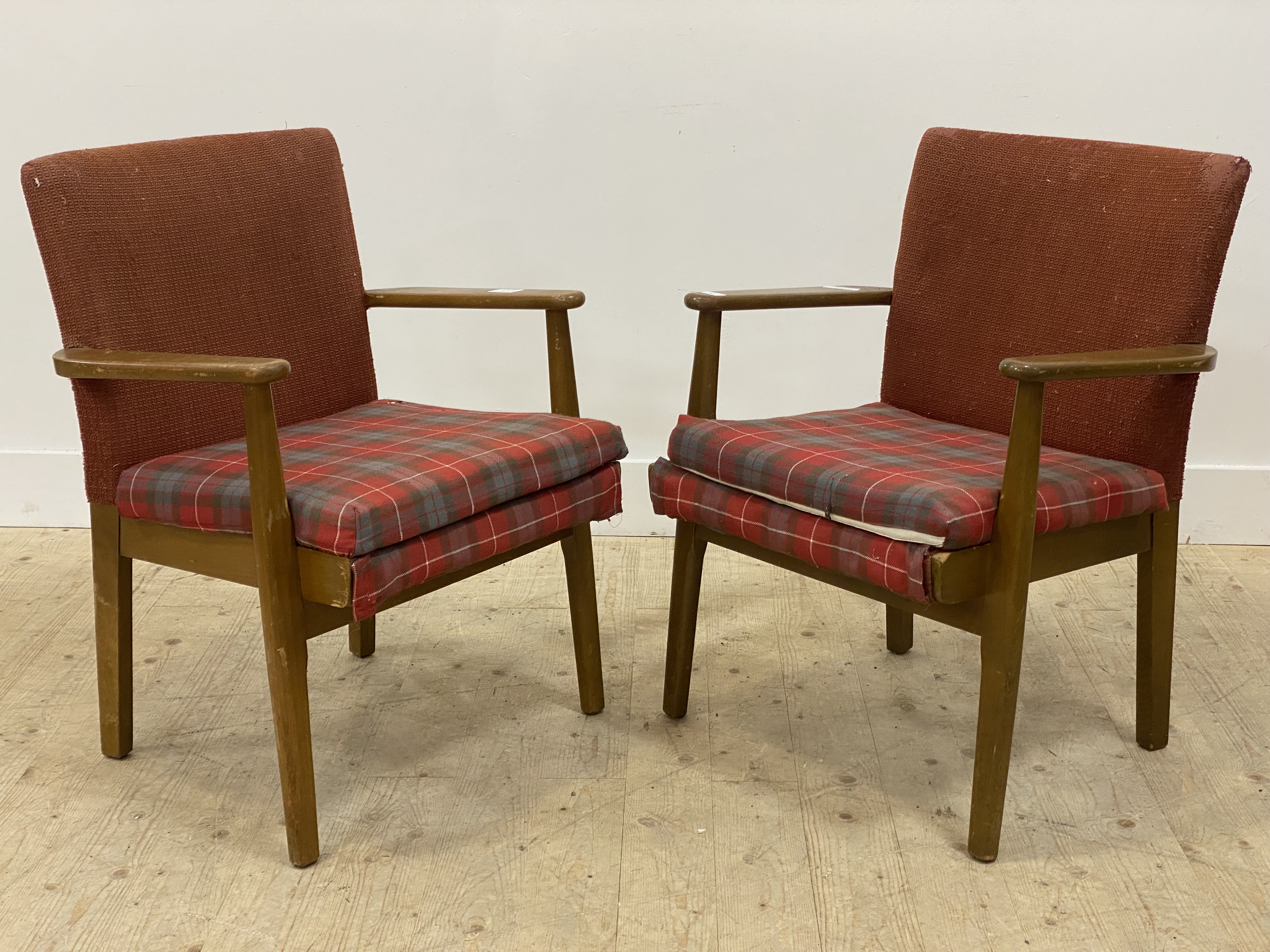 Parker Knoll, a pair of mid century stained beech framed open armchairs, with upholstered squab