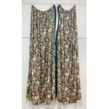 A large pair of glazed floral chintz curtains, box pleated and lined in forrest green chintz, with