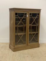 An early 20th century walnut floor standing bookcase, the top with gadroon moulded edge above two