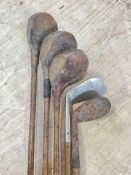 A group of five vintage hickory shaft golf clubs comprising woods and irons including LMD 'Special'/