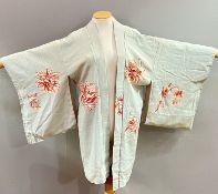 A Japanese silk-lined kimono with abstract chrysanthemum motifs in orange against a light blue