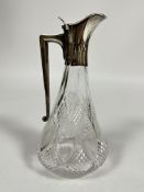 A Victorian baluster crystal slice cut claret jug with Birmingham silver mounted top with tapered