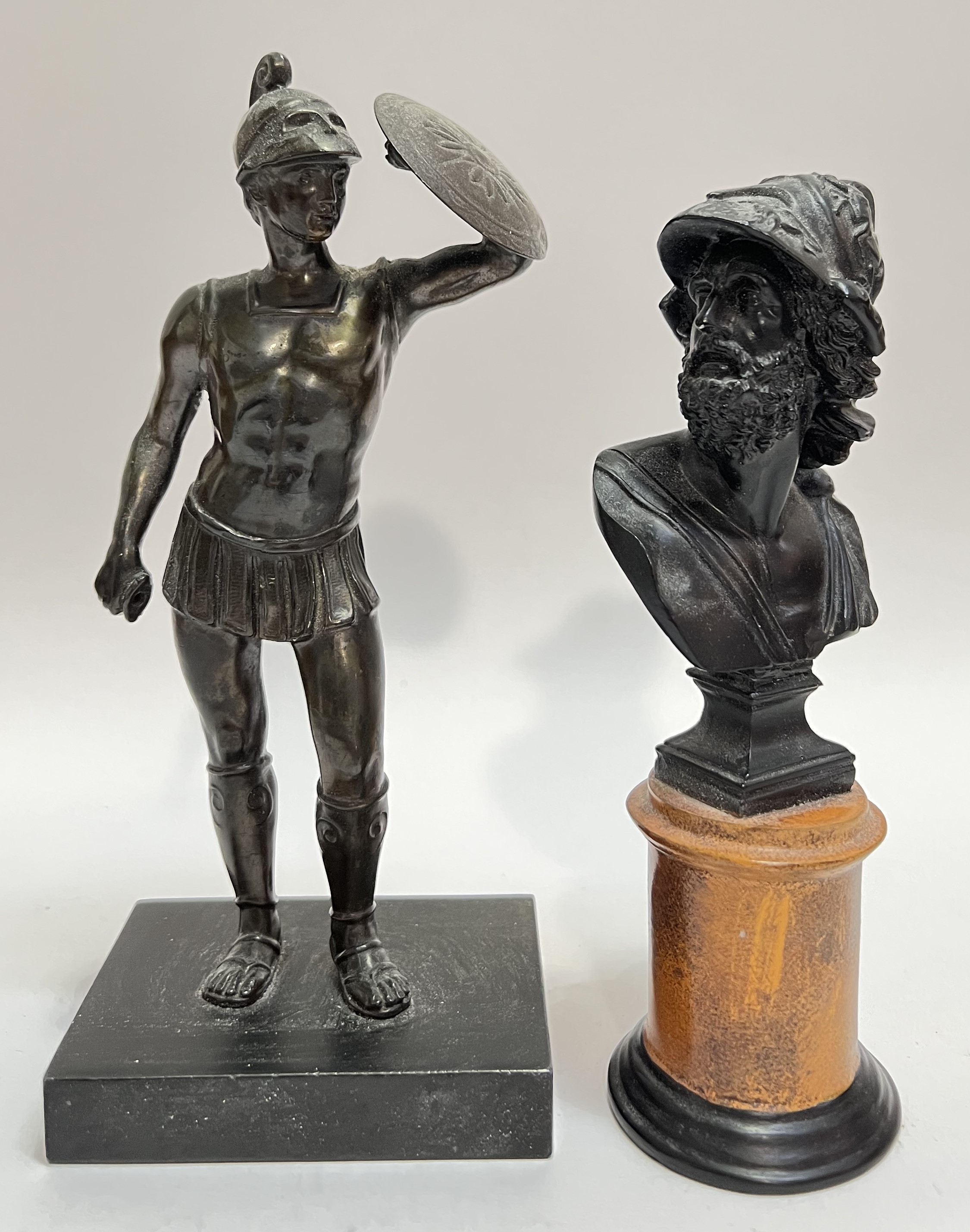 A miniature bronze figure of a soldier of antiquity in the classical style, together with a classica