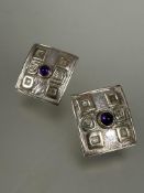 A pair of London silver and yellow metal set rectangular earrings with central cabochon amethyst