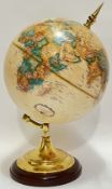 A Replogle 9 Inch diameter globe from the World Classic Series, mounted in lacquered brass on a wood