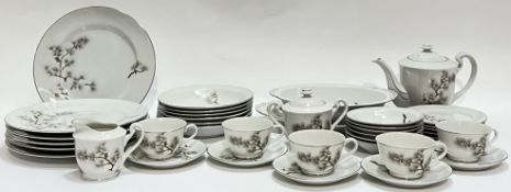 A Japanese LGTC China part tea and dinner service with enamelled decoration of pine trees comprising