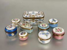 A collection of porcelain table boxes, including a large Limoges rectangular box with gilded
