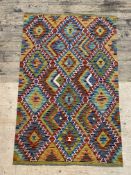 A hand knotted  chobi kilim rug of typical design156cm x 100cm