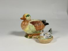 An Italian nesting ceramic duck tureen with spoon (w-18cm h-15cm) and a small ceramic nesting hen (