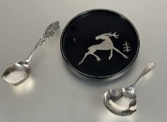 A Victorian silver shaped tea-caddy spoon with bright cut style decoration, London 1892, a