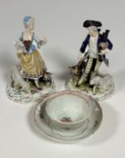 A pair of Meissen style reproduction figures of a Shepard and his wife decorated with polychrome