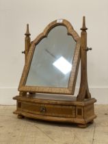 Frank Hudson, an ash vanity mirror of 18th century inspiration, the arched mirror swivelling between