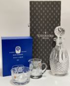 A boxed Waterford Crystal decanter (h- 27cm), together with a boxed Jaffe Rose hand engraved sugar a