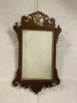 A George III mahogany fretwork mirror with gilt ho-ho bird surmount and moulded slip H60cm, W37cm