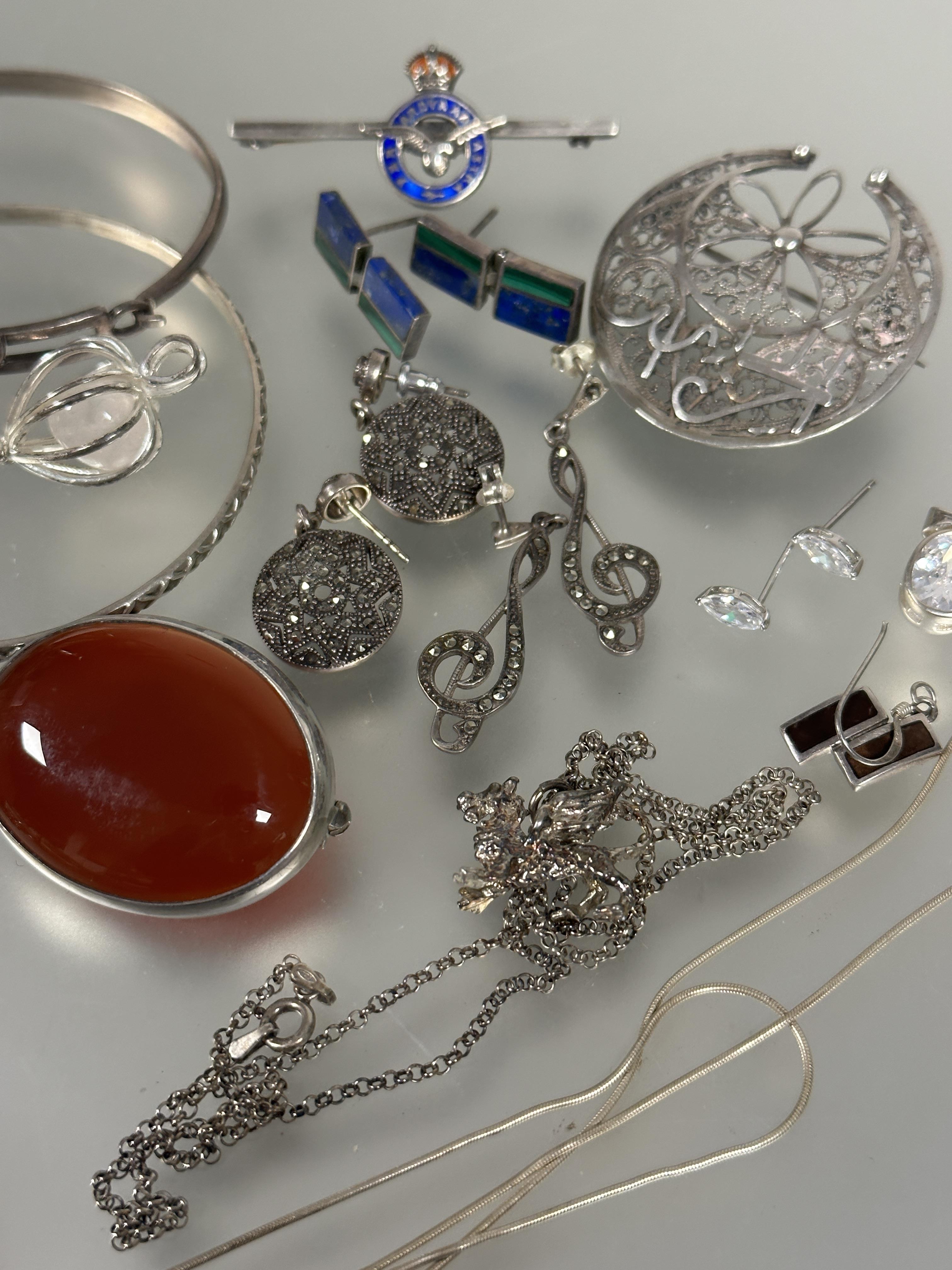 A collection of silver and white metal jewelry including two oval carnelian brooches, a pair of - Image 3 of 4