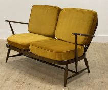 Ercol, a vintage two seat sofa, with hoop and spindle back, and open arms enclosing yellow velvet