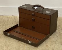 An early to mid 20th century stitched leather travelling vanity case, with swing handle over lid
