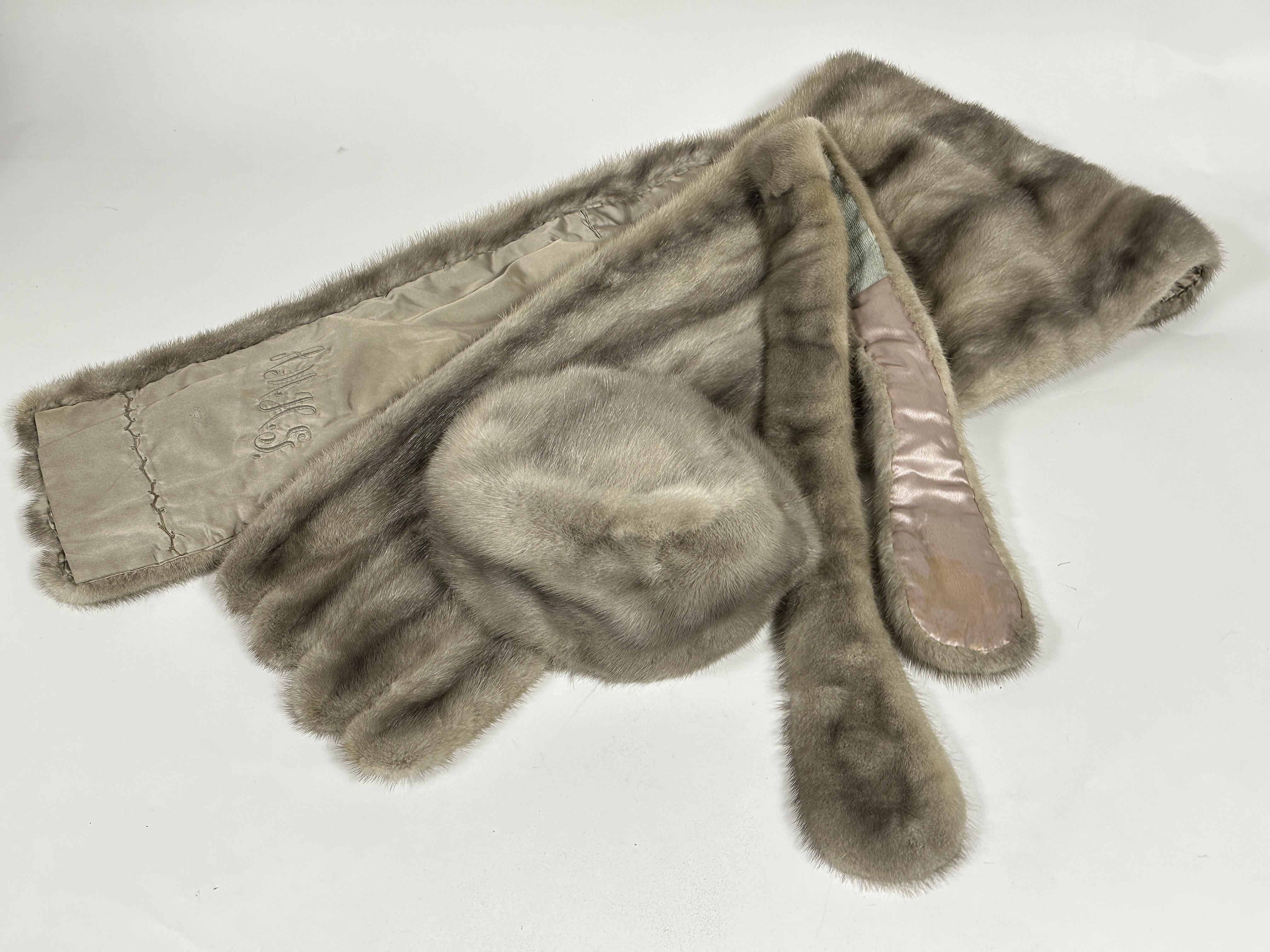 A Lady's 1960's - 70's grey Mink fur evening stole of tapered form with satin lining and embroidered