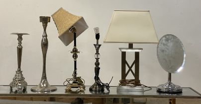 A group of three modern table lamps, together with two polished metal candle sticks, and a chrome