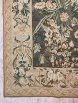OKA, an embroidered wall hanging tapestry or rug in the French style, the ground decorated with