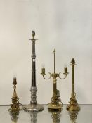 A group of four traditional style table lamps