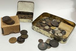 A large group of mixed coins comprising, two boxes/tins of pennies, and a tin of mixed international