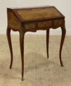 A French kingwood marquetry bureau de dame writing desk, the writing slant opening to a skivered