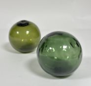 A pair of hand blown bottle green fisherman's Lobster creel floats, one embossed WD, (D x 12 cm)