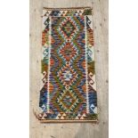 A hand knotted  chobi kilim runner rug of all over geometric design 150cm x 69cm