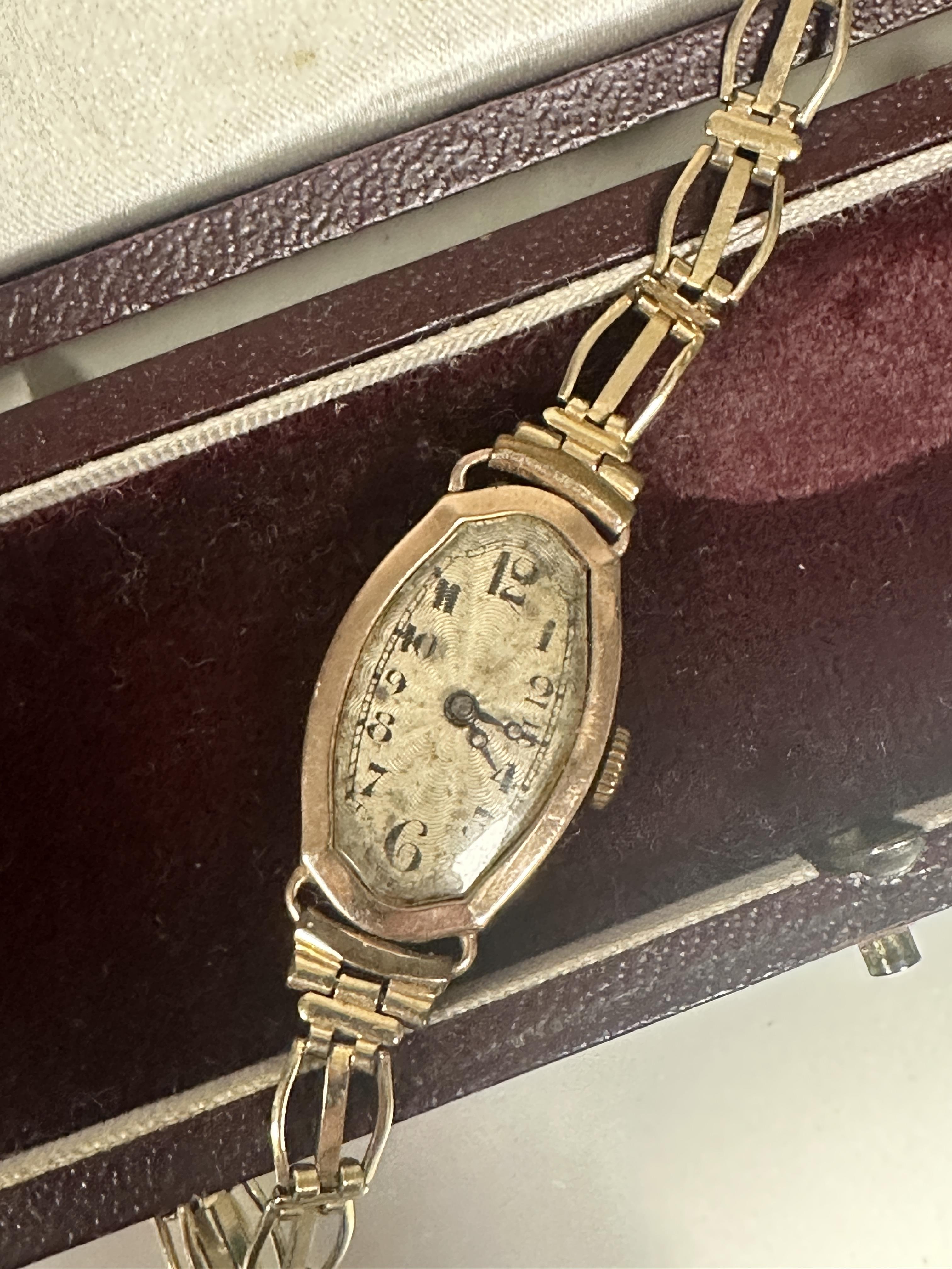 A Lady's 1900 Vintage 9ct gold oval shaped Swiss wristwatch with silver engine turned dial and - Image 2 of 3