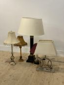 A group of five modern table lamps