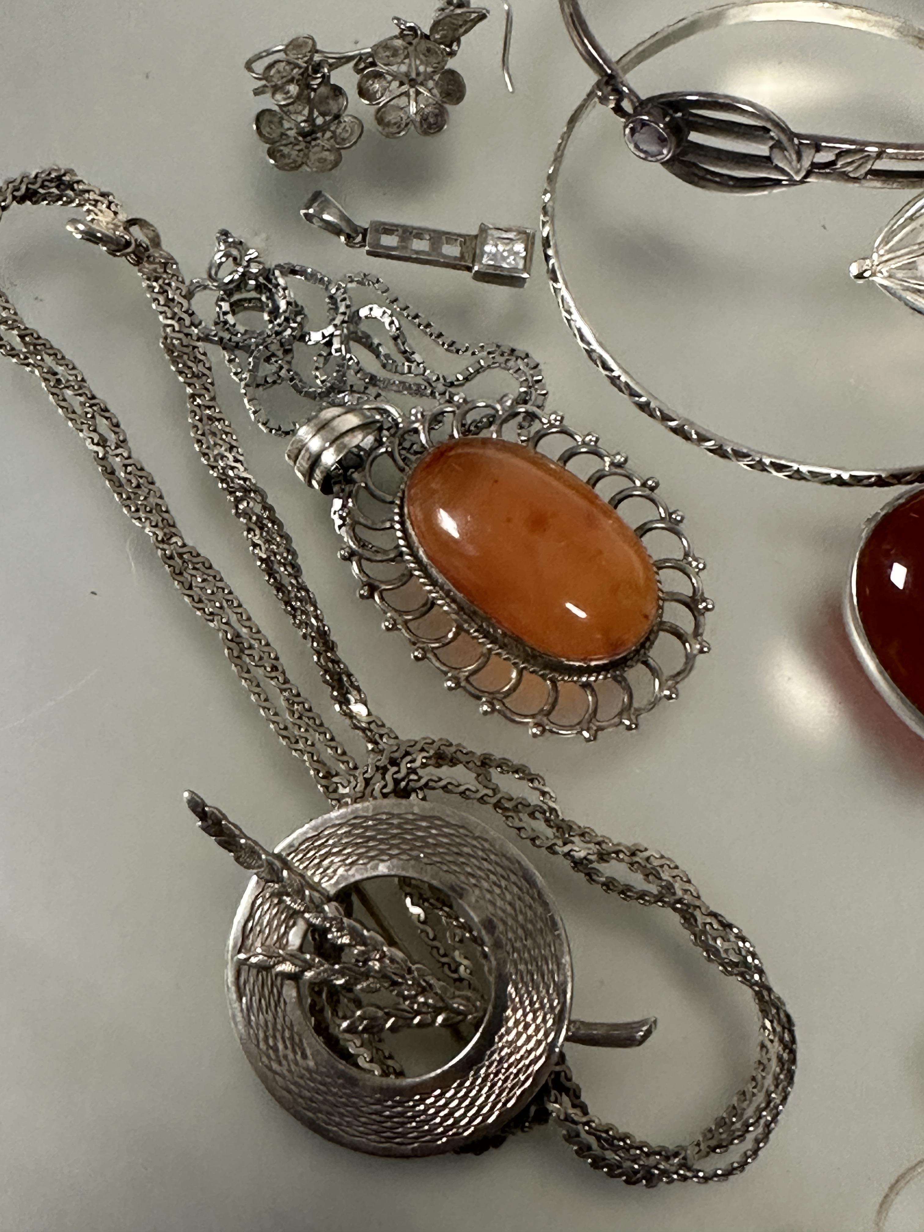 A collection of silver and white metal jewelry including two oval carnelian brooches, a pair of - Image 2 of 4