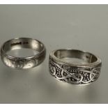 A 18ct white gold engraved ring,T, 7.9g and a 9ct white gold Celtic knot cuff style ring, Q/R, 6.2g.