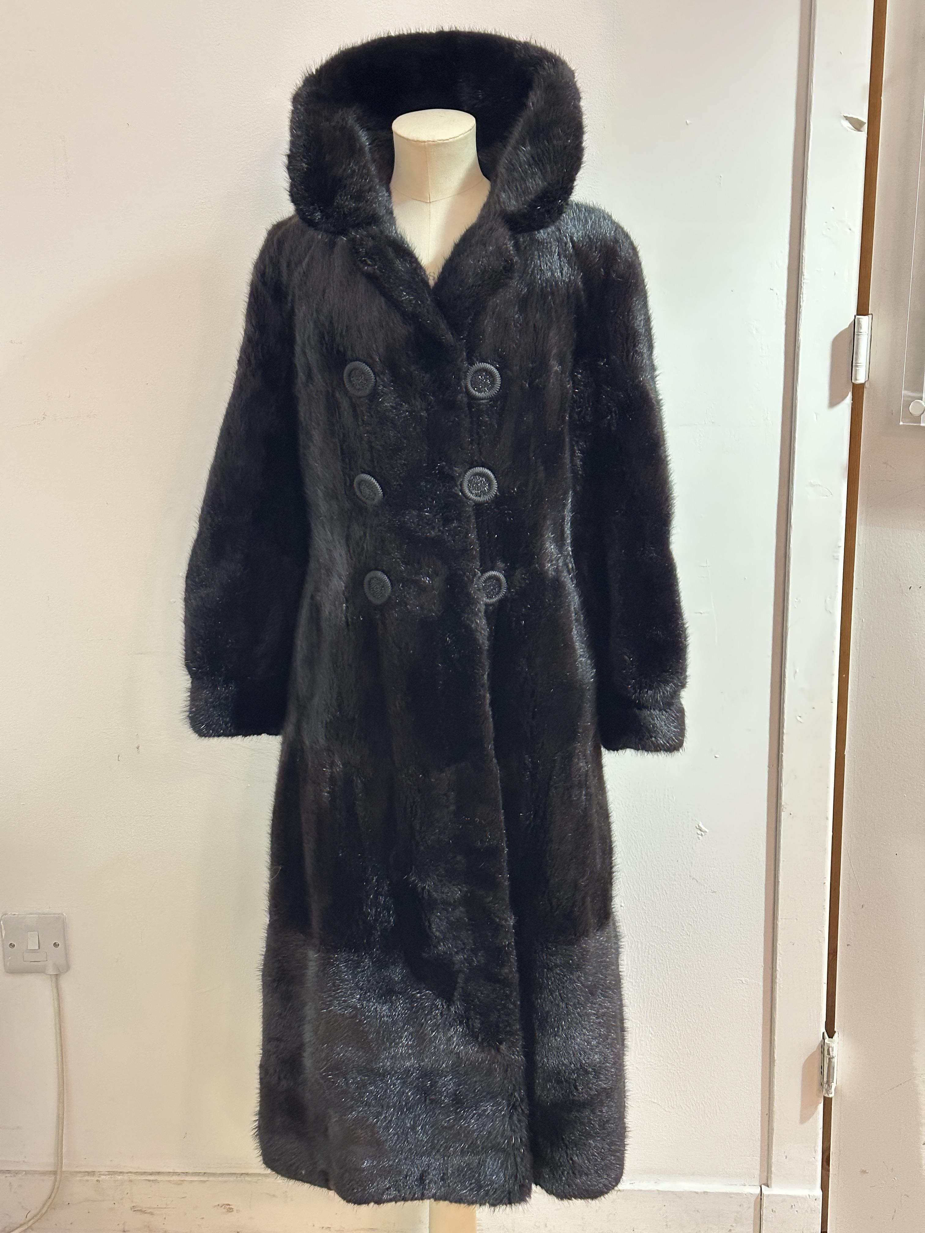 A Lady's wild ranch Mink full length coat and full fold over collar and satinised lining and two set