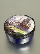 A late 18thc Continental circular enamel snuff box , the top with figures by the shore while ships