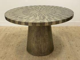 An unusual contemporary dining table, the circular top and pedestal base of conical form covered